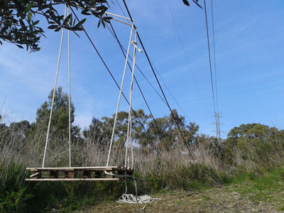 swing hanging from disabled high voltage cables